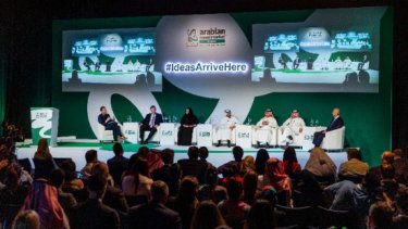 ATM Event stage with the people speaking in front